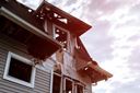 The aftermath of tornado damage on a houses exterior